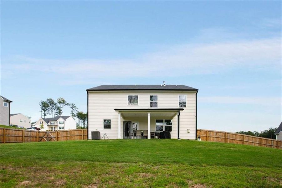 Front exterior of a new home in Stillwater Springs, Dacula, GA, highlighting curb appeal (Image 23). Front exterior of a new home in Stillwater Springs, Dacula, GA, highlighting curb appeal (Image 23).