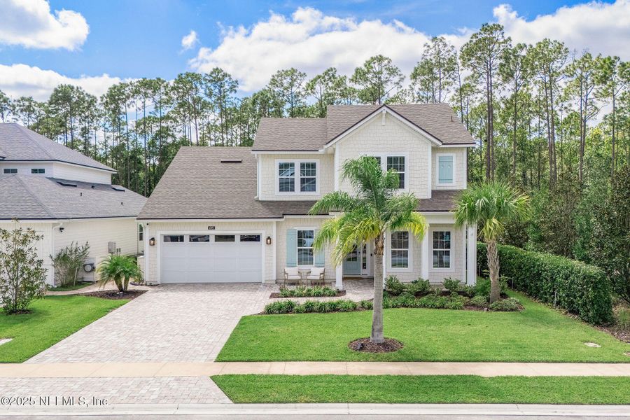 Front exterior of a new home in Palm Crest AT Seabrook, Ponte Vedra, FL, highlighting curb appeal (Image 26).