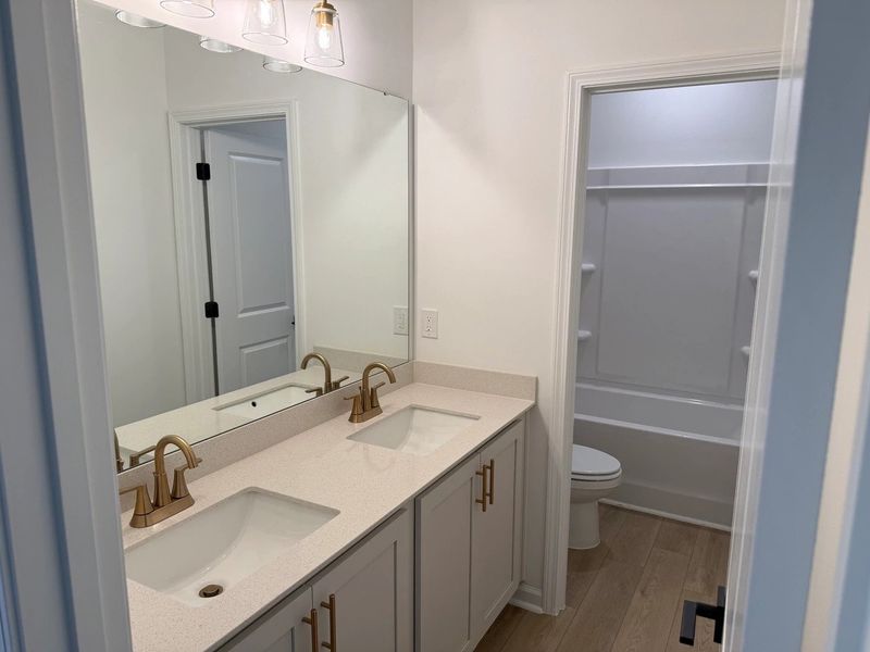 Bath 2 featuring the AW Collection® Serene - Earth-toned surfaces bring warmth and calm. Bath 2 featuring the AW Collection® Serene - Earth-toned surfaces bring warmth and calm.