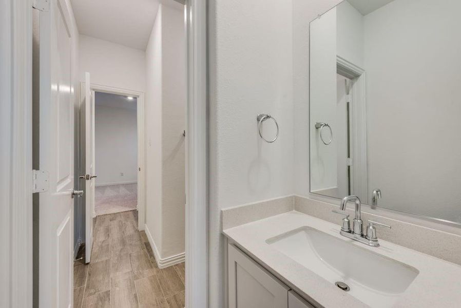 Bathroom with vanity and hardwood / wood-style floors