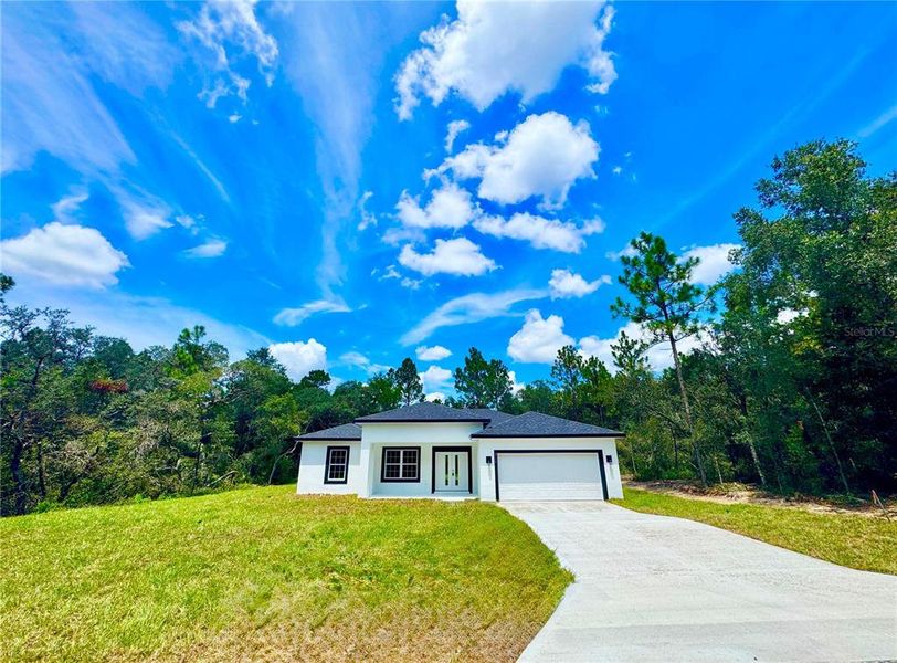 Front exterior of a new home in , Citrus Springs, FL, highlighting curb appeal (Image 18).