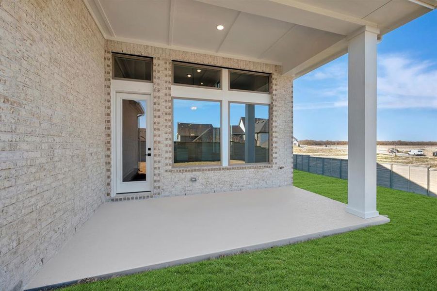 Exterior details and patio area of a home in Treeline, Justin (Image 3).