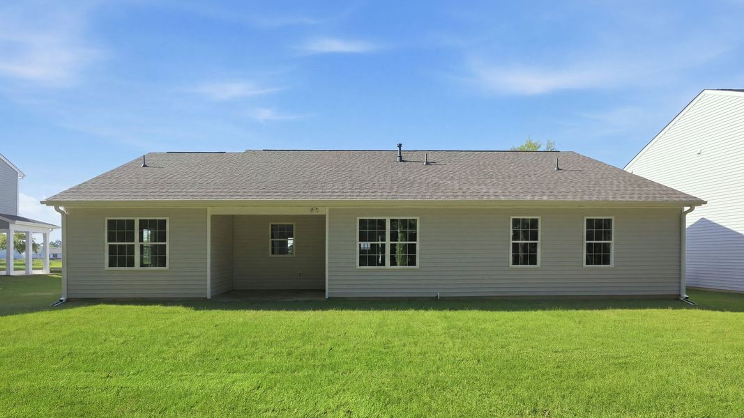 Exterior details and patio area of a home in Tyler - Home on the Lake, New Bern (Image 19).