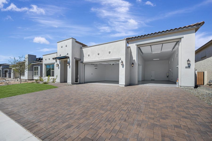 Exterior details and patio area of a home in Sentiero at Windrose, Waddell (Image 3).