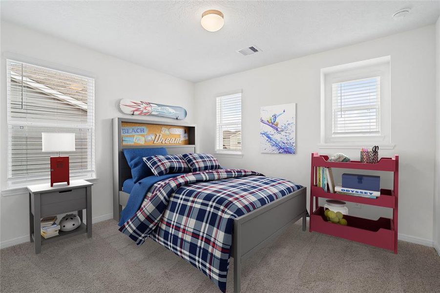 Secondary bedroom features plush carpet, neutral paint, lighting, large windows with privacy blinds and ample sized closet space.