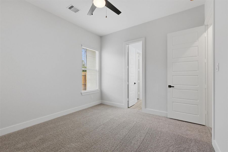 Alternate view of bedroom 3 into the other side of the connected bathroom!
