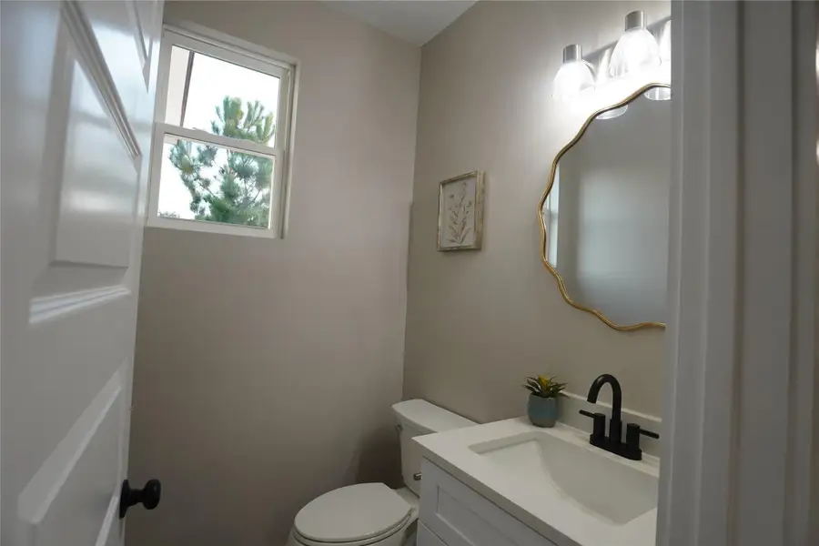 Half Bathroom with vanity and toilet