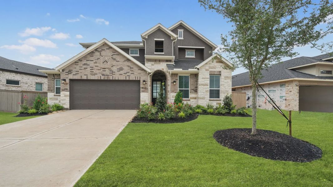 Representative exterior photo of a completed home built from the Madison by Chesmar Homes in Elyson 50's, Katy, TX (Image 2). Representative exterior photo of a completed home built from the Madison by Chesmar Homes in Elyson 50's, Katy, TX (Image 2).