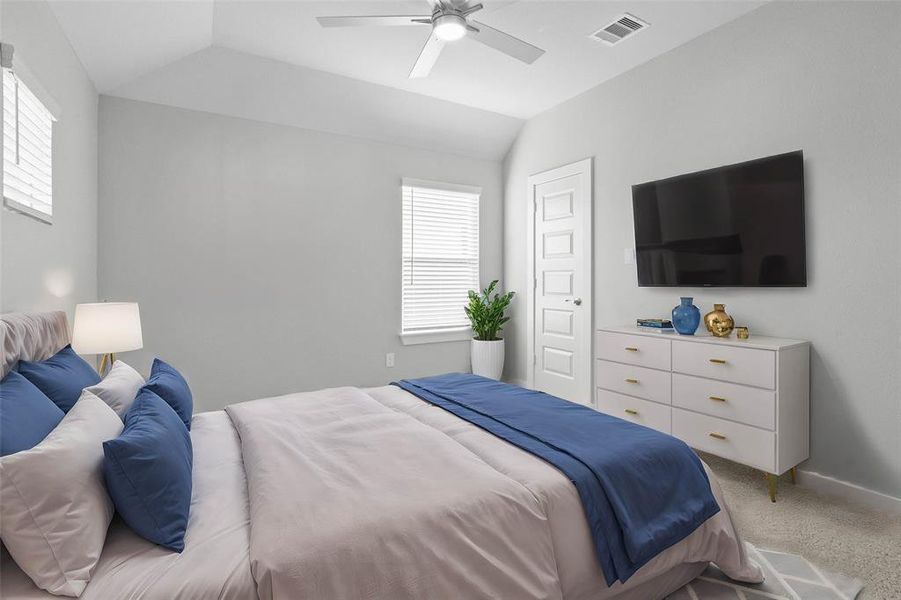 Secondary bedroom features plush carpet, custom paint, high ceilings with ceiling fan, windows with privacy blinds, and ample closet space.