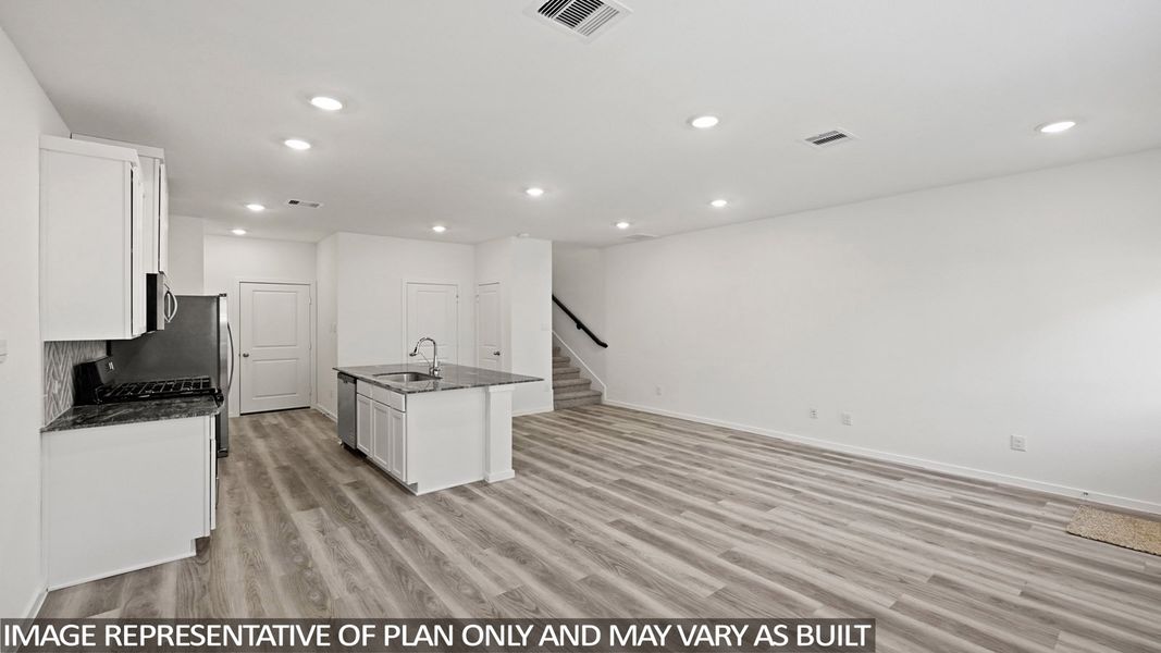 Furnished interior view inside a new home in Bridges on Lake Houston Villas, Humble (Image 6).