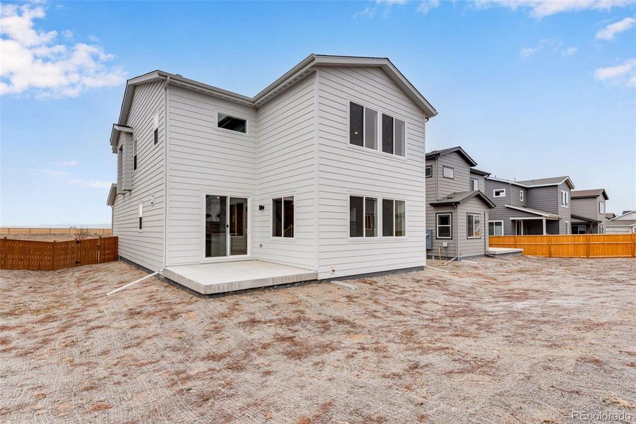Exterior details and patio area of a home in Reunion, Commerce City (Image 25).