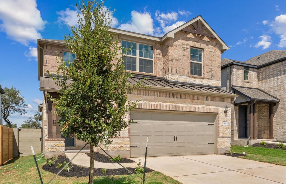 Front exterior of a new home in Wolf Ranch, Georgetown, TX, highlighting curb appeal (Image 18).