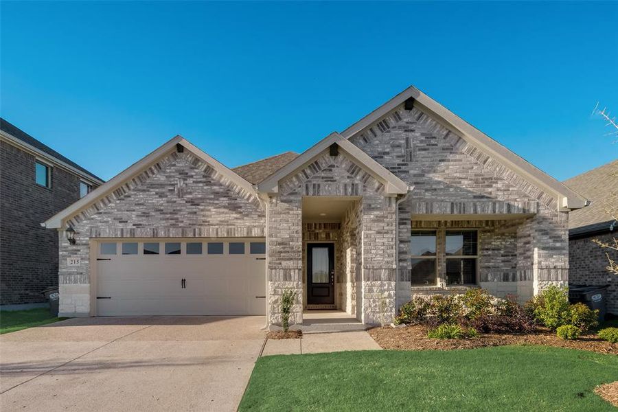 Front exterior of a new home in The Quarry at Stoneridge, Melissa, TX, highlighting curb appeal (Image 2).