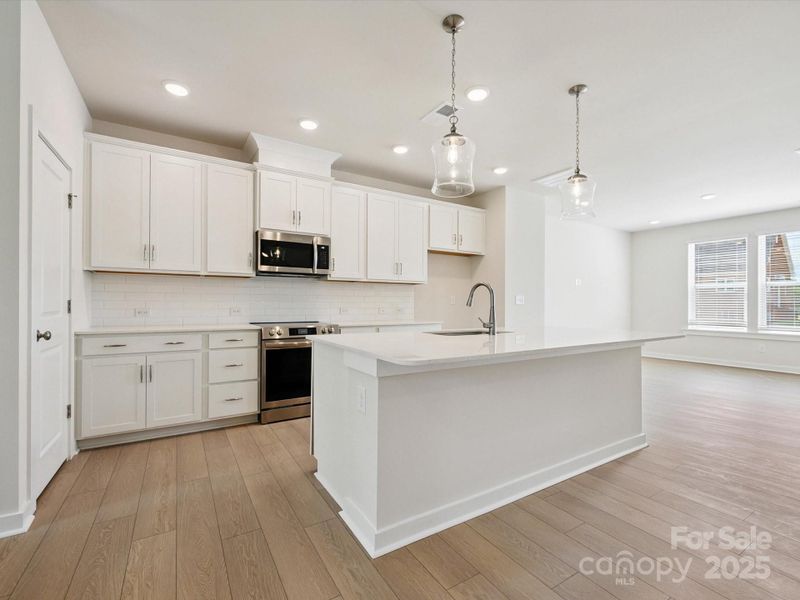 Furnished interior view inside a new home in Central Living at Craig, Charlotte (Image 4).