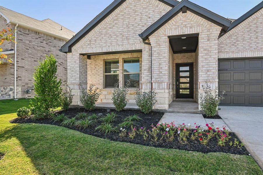 Exterior details and patio area of a home in Lakehaven - Signature Series, Farmersville (Image 3). Exterior details and patio area of a home in Lakehaven - Signature Series, Farmersville (Image 3).