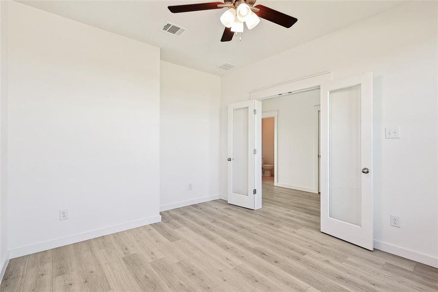 Unfurnished room featuring light hardwood / wood-style floors and ceiling fan