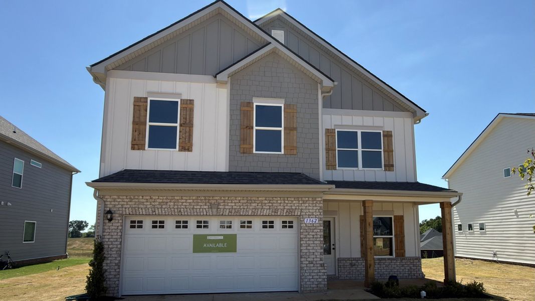 Front exterior of a new home in The Oaks, Clarksville, TN, highlighting curb appeal (Image 1). Front exterior of a new home in The Oaks, Clarksville, TN, highlighting curb appeal (Image 1).