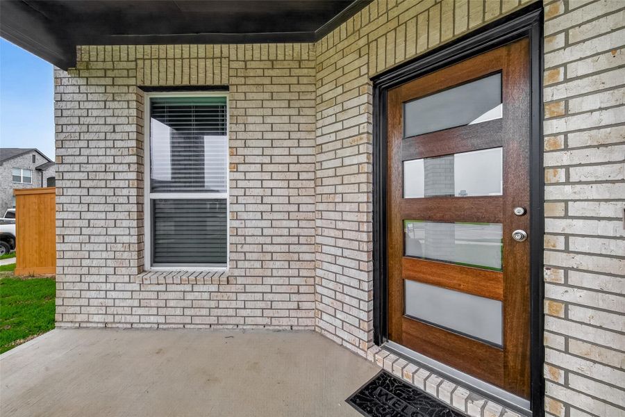 Exterior details and patio area of a home in Sunterra, Katy (Image 3).