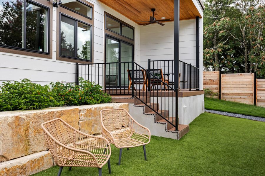 The beautifully landscaped rear yard is enclosed by a privacy fence, creating a serene and secluded outdoor oasis for relaxation and enjoyment.