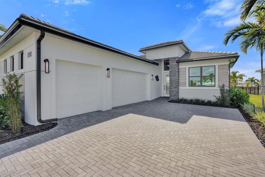 Exterior details and patio area of a home in Esprit at Avenir, Palm Beach Gardens (Image 23).