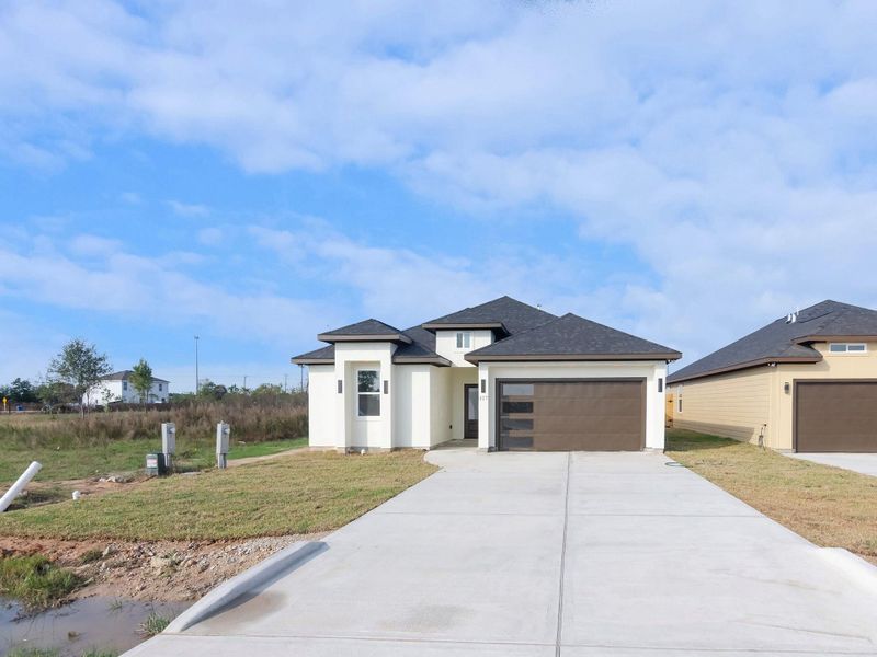 Front exterior of a new home in , Cleveland, TX, highlighting curb appeal (Image 23). Front exterior of a new home in , Cleveland, TX, highlighting curb appeal (Image 23).