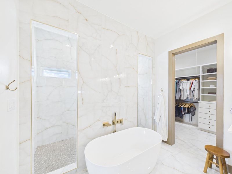 Walk in shower with dual entry and separate soaking tub