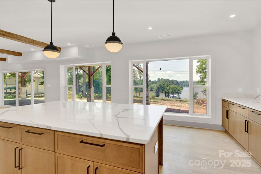 Basement kitchen has huge island to allow for additional seating Basement kitchen has huge island to allow for additional seating