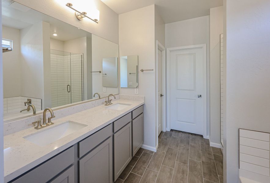 A bathroom with a large mirror. A bathroom with a large mirror.