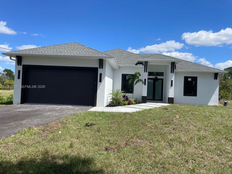 Front exterior of a new home in , Naples, FL, highlighting curb appeal (Image 17). Front exterior of a new home in , Naples, FL, highlighting curb appeal (Image 17).