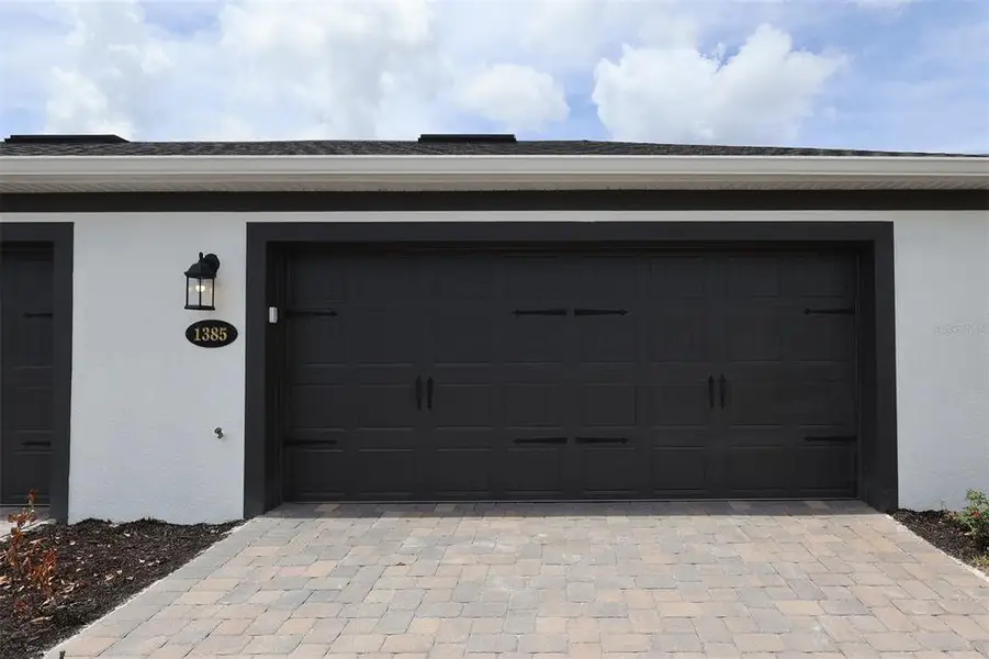 Exterior details and patio area of a home in Center Lake on the Park, St. Cloud (Image 19).