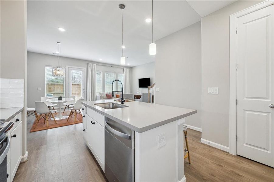 A view of the first floor, openconcept kitchen and living area.