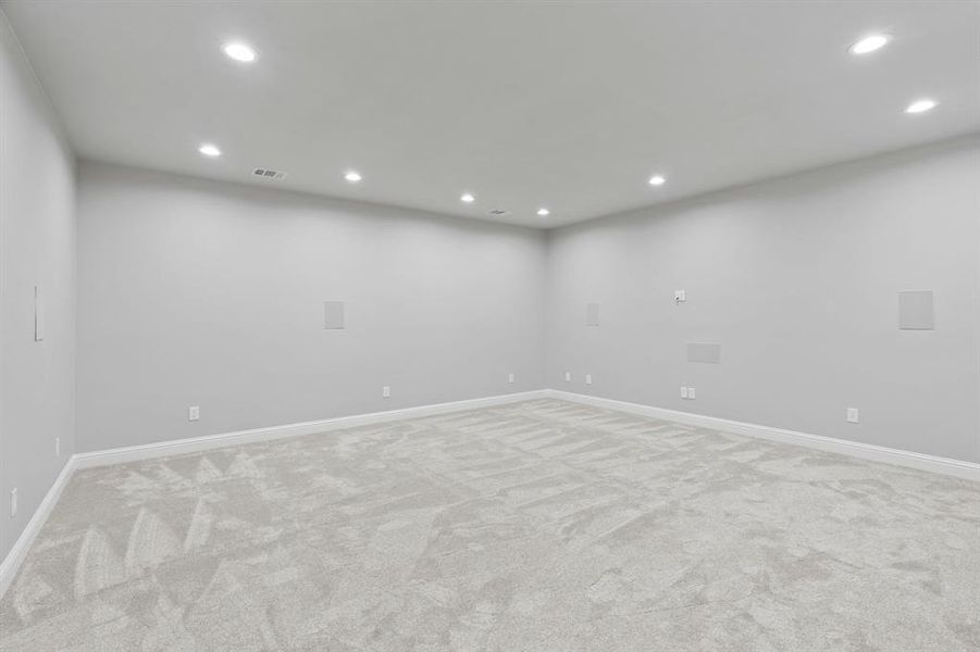 Empty room with light colored carpet