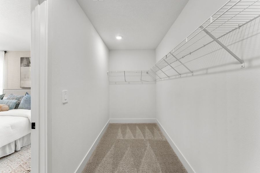 Primary Bedroom Walk-In Closet Primary Bedroom Walk-In Closet