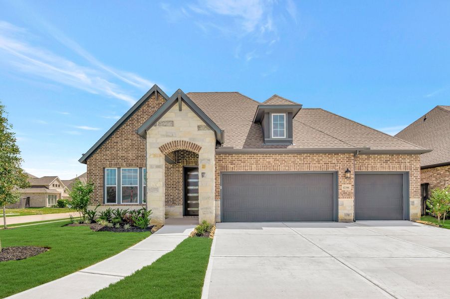 Front exterior of a new home in Riceland - Enclave Collection, Mont Belvieu, TX, highlighting curb appeal (Image 2). Front exterior of a new home in Riceland - Enclave Collection, Mont Belvieu, TX, highlighting curb appeal (Image 2).