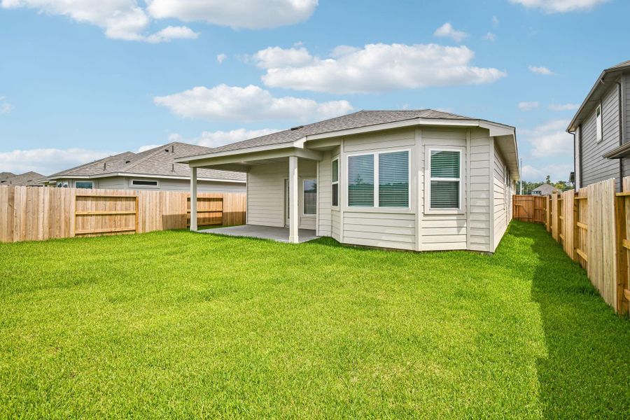 Exterior details and patio area of a home in Riviera Pines - Premier Series, Huffman (Image 3).