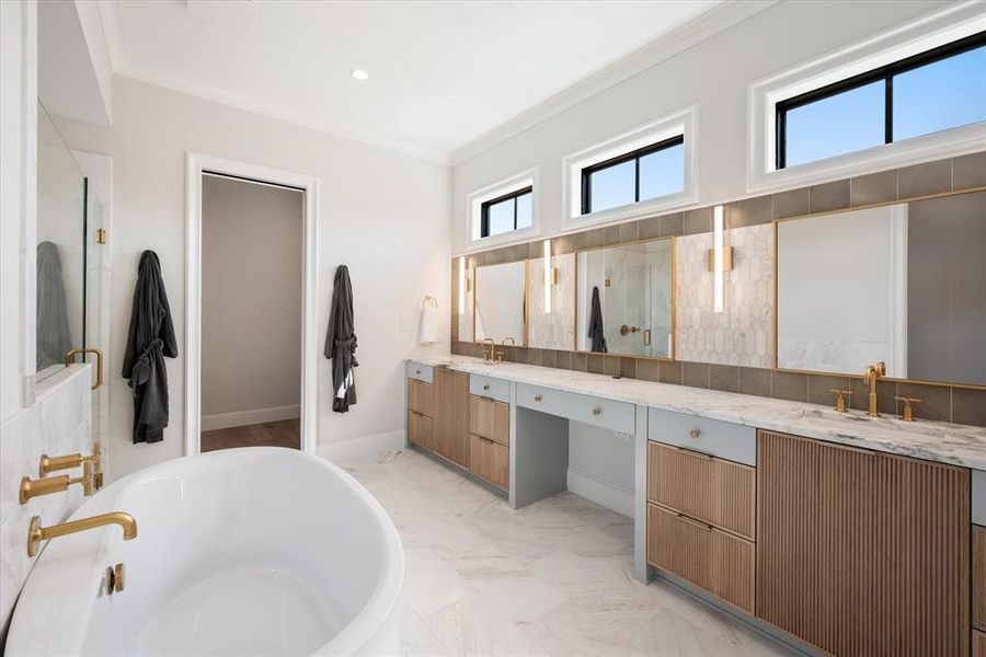 Luxury bathroom leading into closet