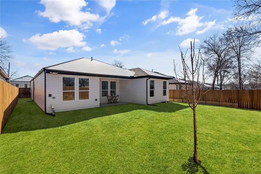 Back of property featuring a fenced backyard and a patio Back of property featuring a fenced backyard and a patio