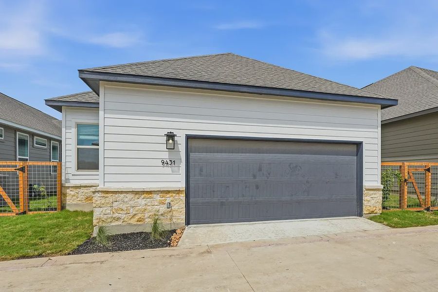 Front exterior of a new home in The Crossvine, Schertz, TX, highlighting curb appeal (Image 23).