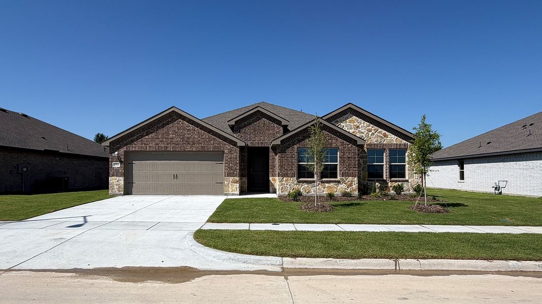 Front exterior of a new home in Northspur, Terrell, TX, highlighting curb appeal (Image 2). Front exterior of a new home in Northspur, Terrell, TX, highlighting curb appeal (Image 2).