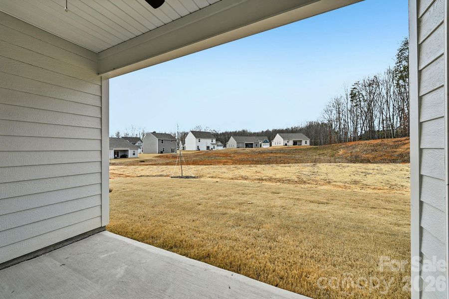 Exterior details and patio area of a home in Colonial Crossing, Troutman (Image 13).
