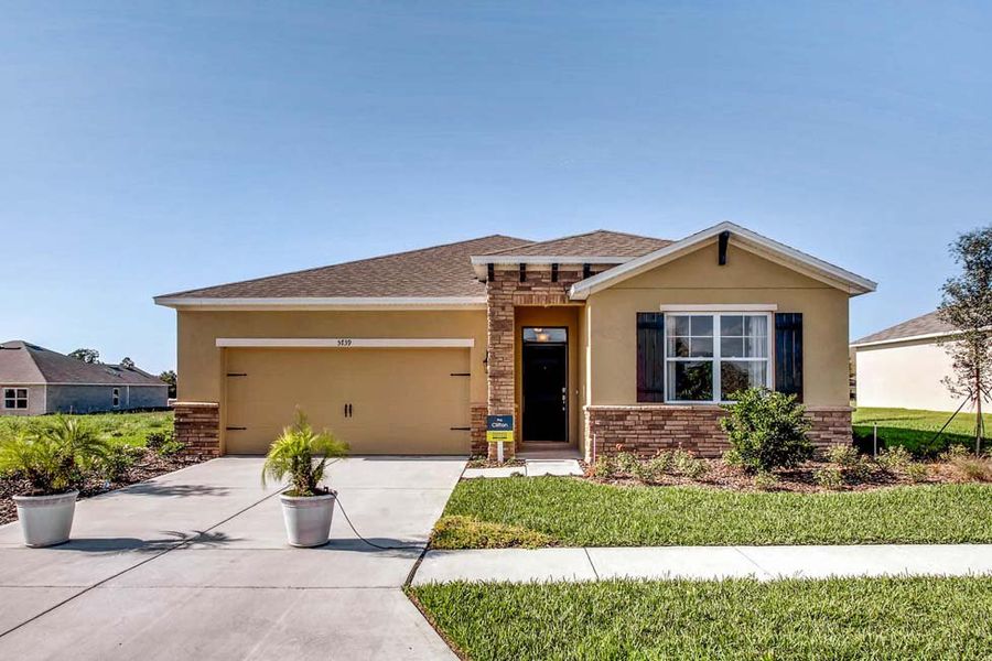 Front exterior of a home in the Preserves at Lakeside Landings community, located in Winter Haven, FL (Image 7).