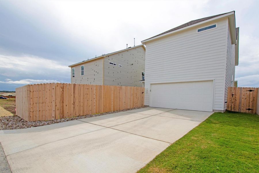 Exterior details and patio area of a home in The Cottages at Lariat, Liberty Hill (Image 12).