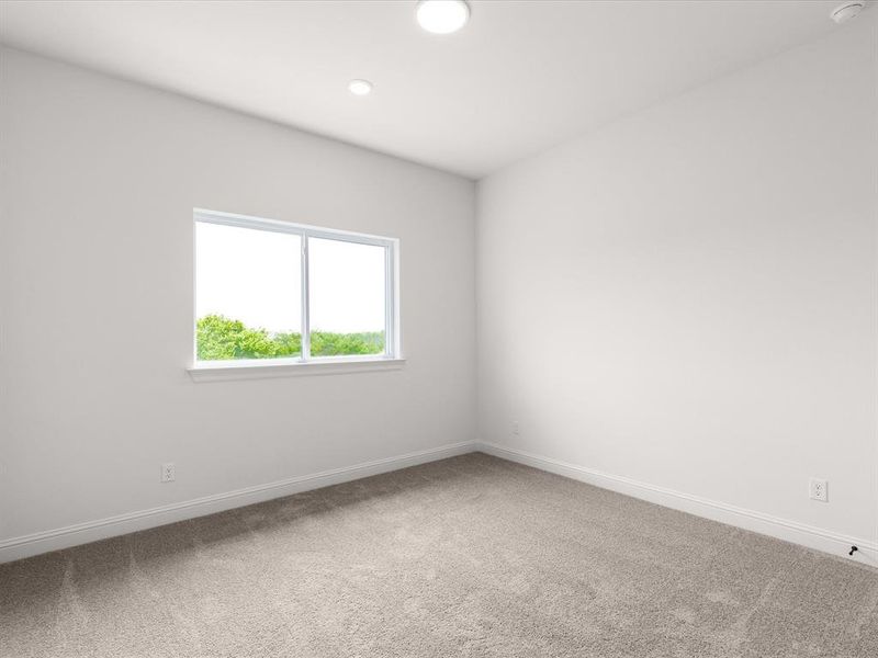 Spare room featuring light carpet and recessed lighting
