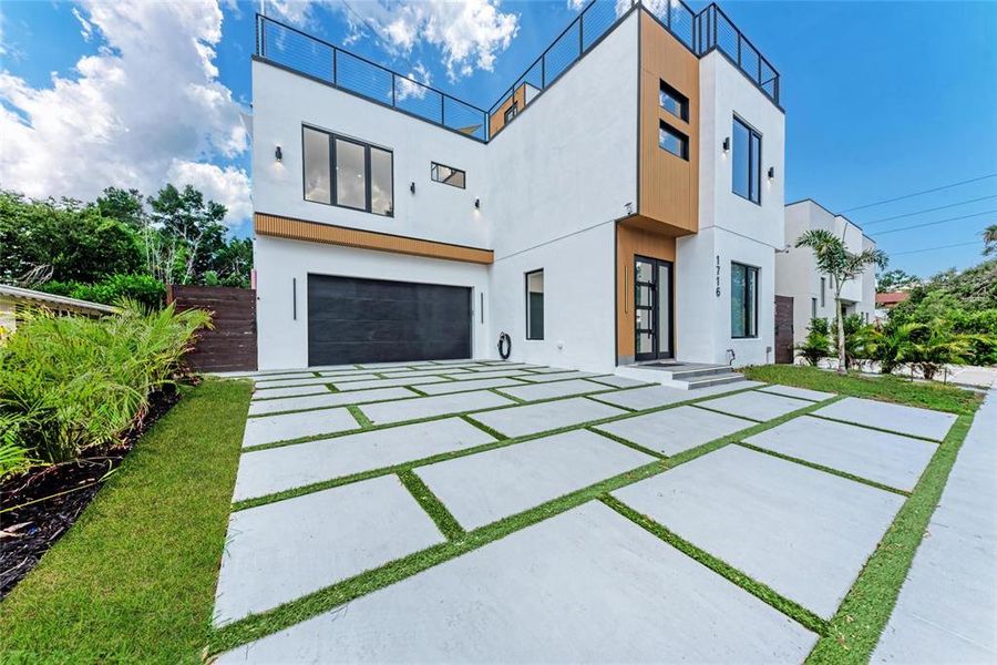Front exterior of a new home in , Sarasota, FL, highlighting curb appeal (Image 30).