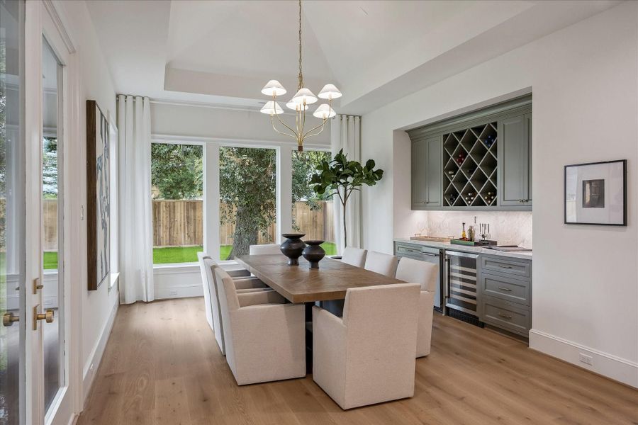 Formal dining area with wine storage, ice maker and fridge