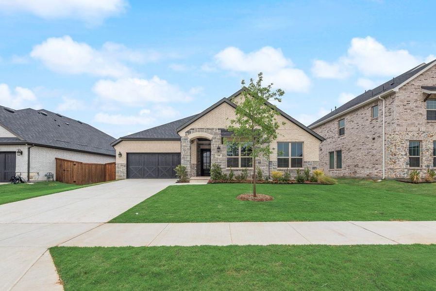 Front exterior of a new home in Valencia On The Lake, Little Elm, TX, highlighting curb appeal (Image 24).
