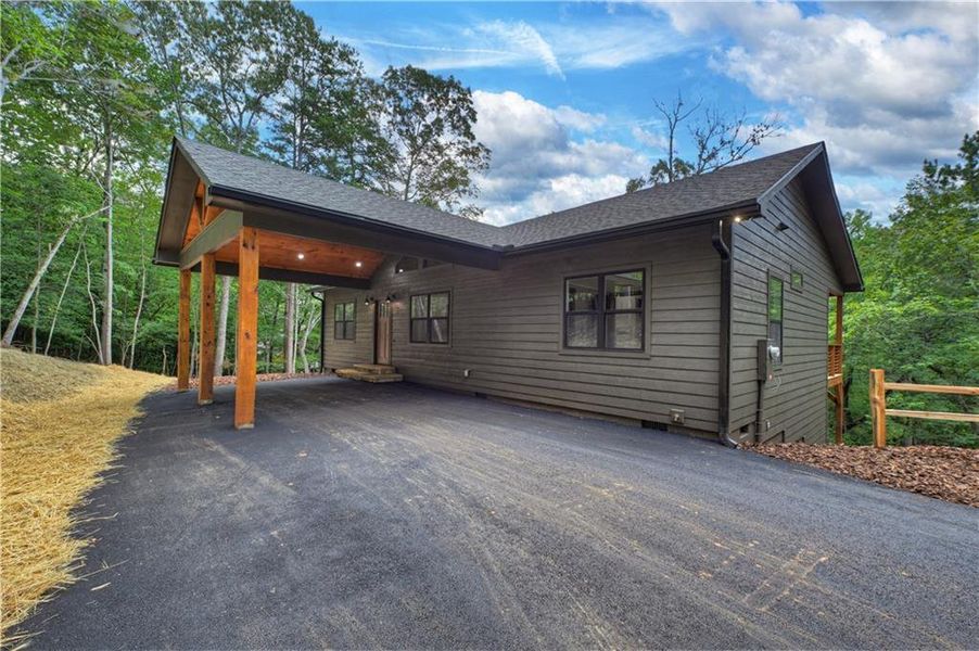 Exterior details and patio area of a home in , Ellijay (Image 24).