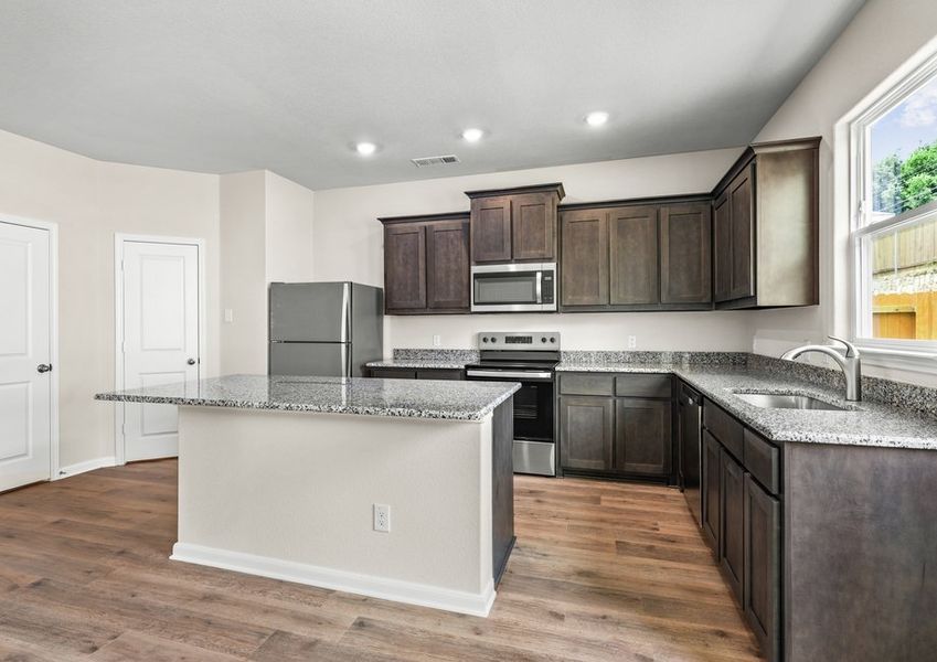 The kitchen has a wonderful island that provides more counterspace.