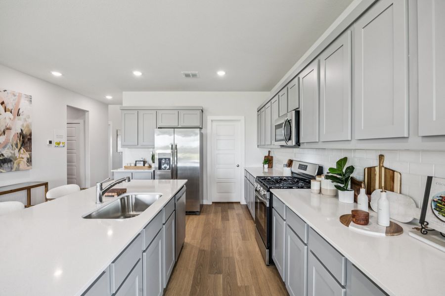 Kitchen in the Winters home plan by Trophy Signature Homes – REPRESENTATIVE PHOTO Kitchen in the Winters home plan by Trophy Signature Homes – REPRESENTATIVE PHOTO