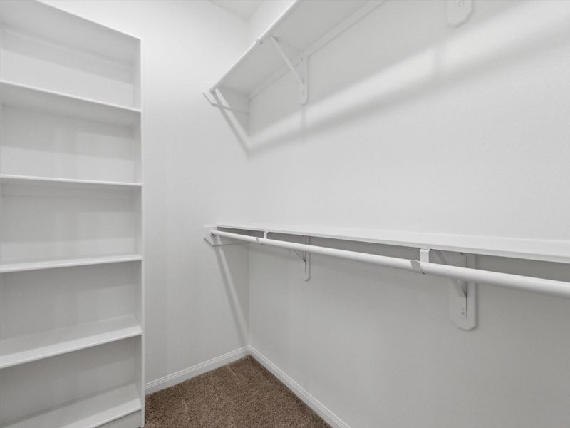 The spacious primary walk-in closet is thoughtfully designed with built-in storage, offering both convenience and everyday ease. The spacious primary walk-in closet is thoughtfully designed with built-in storage, offering both convenience and everyday ease.